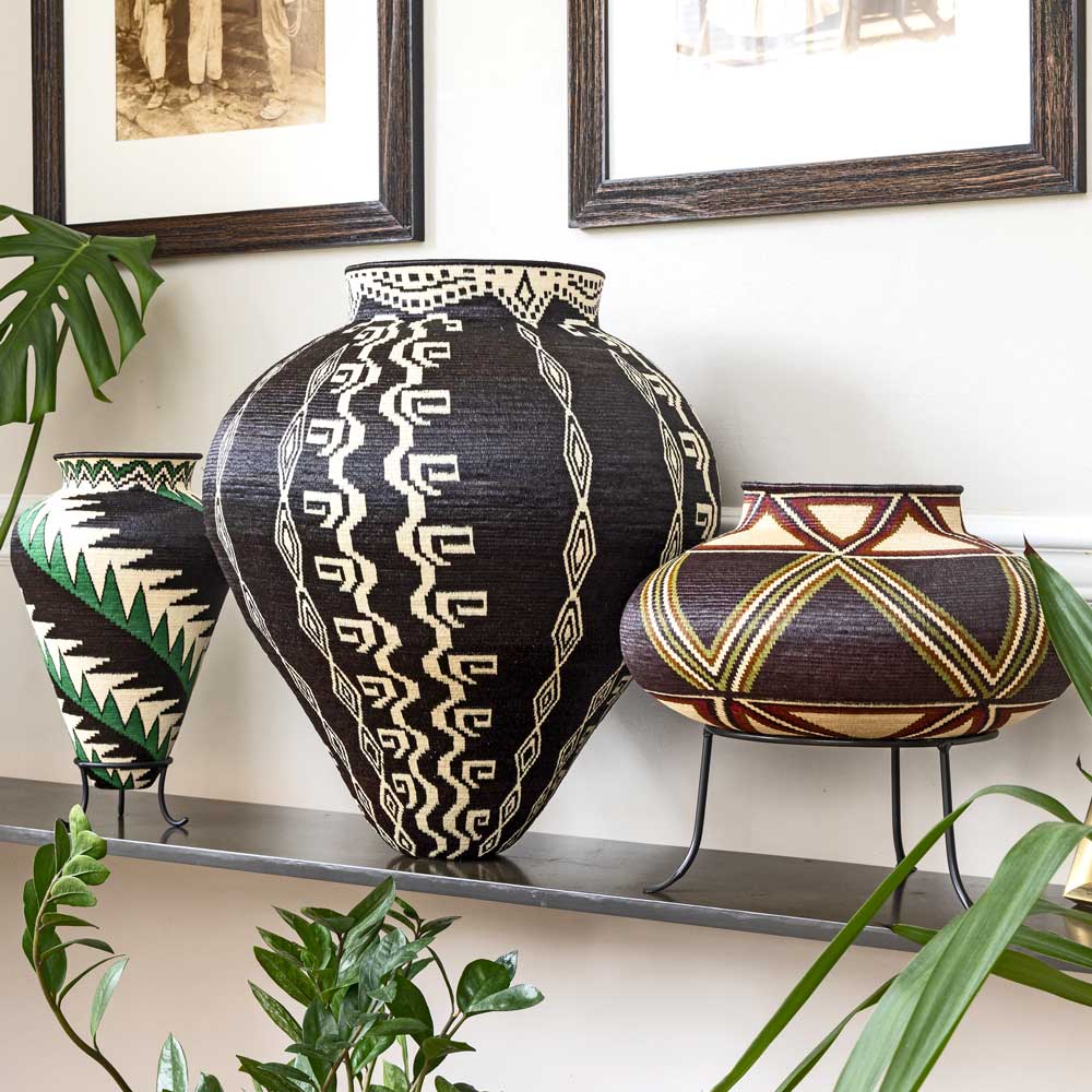 Handwoven basket featuring black and white geometric patterns, crafted by Wounaan or Embera artist using natural palm fiber and dyes — RFB Woven Art collection