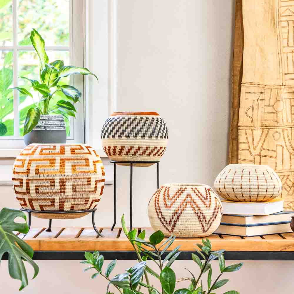 Handwoven basket from Colombia’s Wounaan artists featuring palm fiber and copper wire detailing — part of RFB Woven Art’s Copper Collection