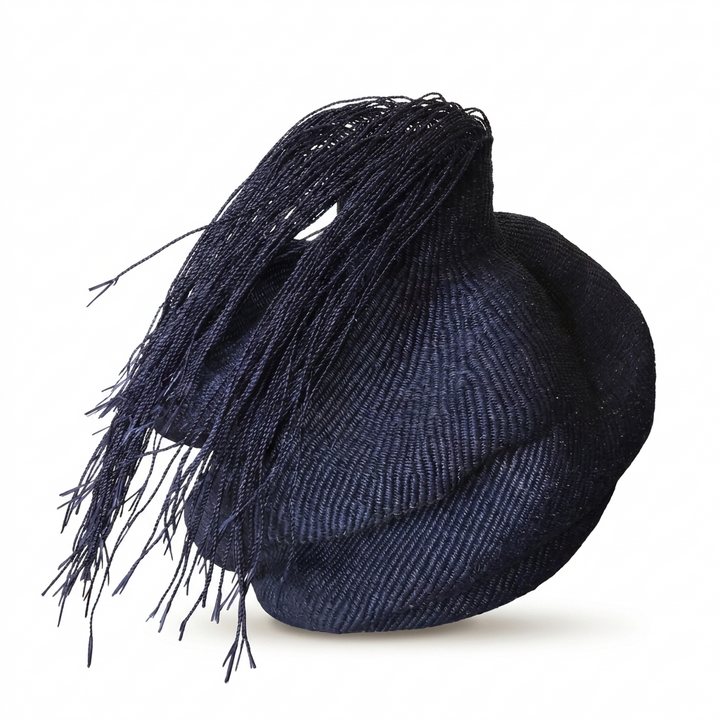 Hairy black wavy sculptural basket, alternate angle on white