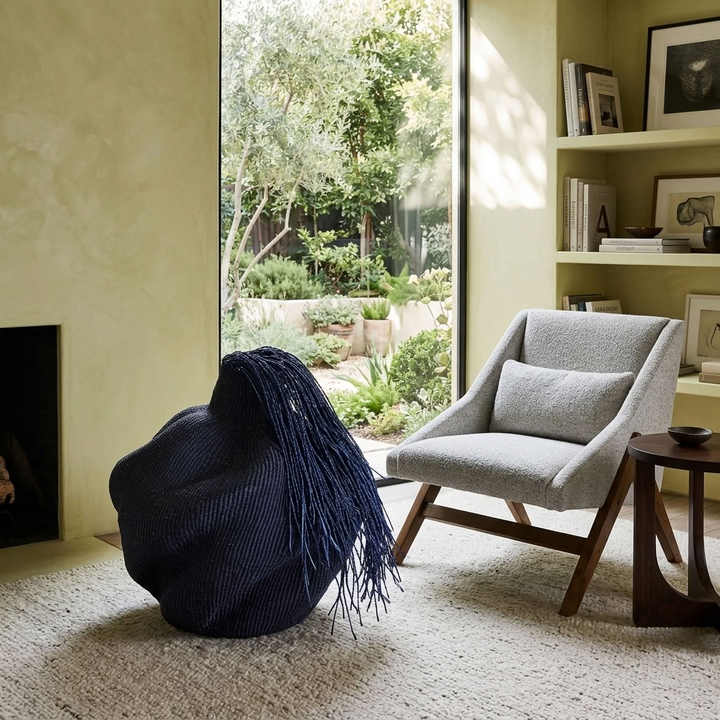 Black hairy wavy sculptural basket styled in an interior, alternate scene