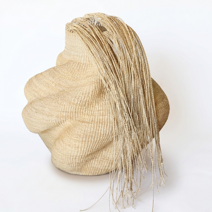 Hairy natural wavy sculptural basket, alternate angle on white