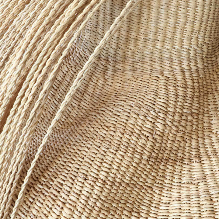 Close detail of the fringe and weave on the hairy natural wavy basket