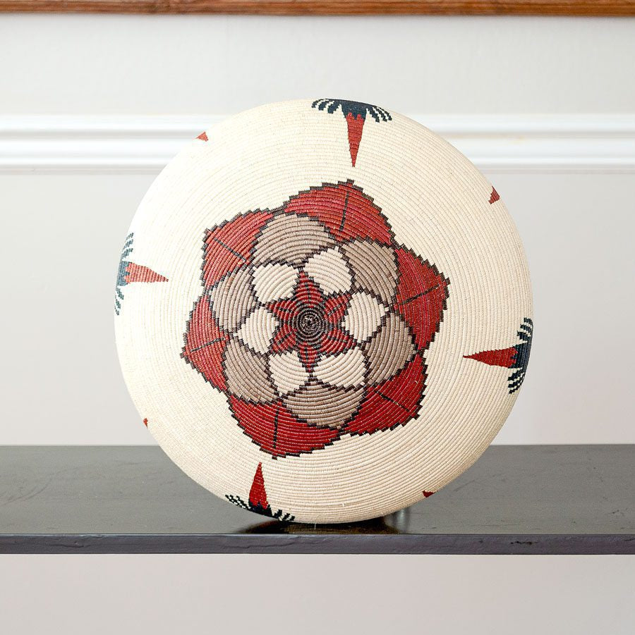 rear view of handmade Wounaan macaws basket showing cocobolo wood rim and traditional palm weaving technique