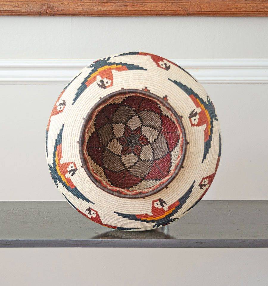top view of handmade Wounaan macaws basket showing cocobolo wood rim and traditional palm weaving technique