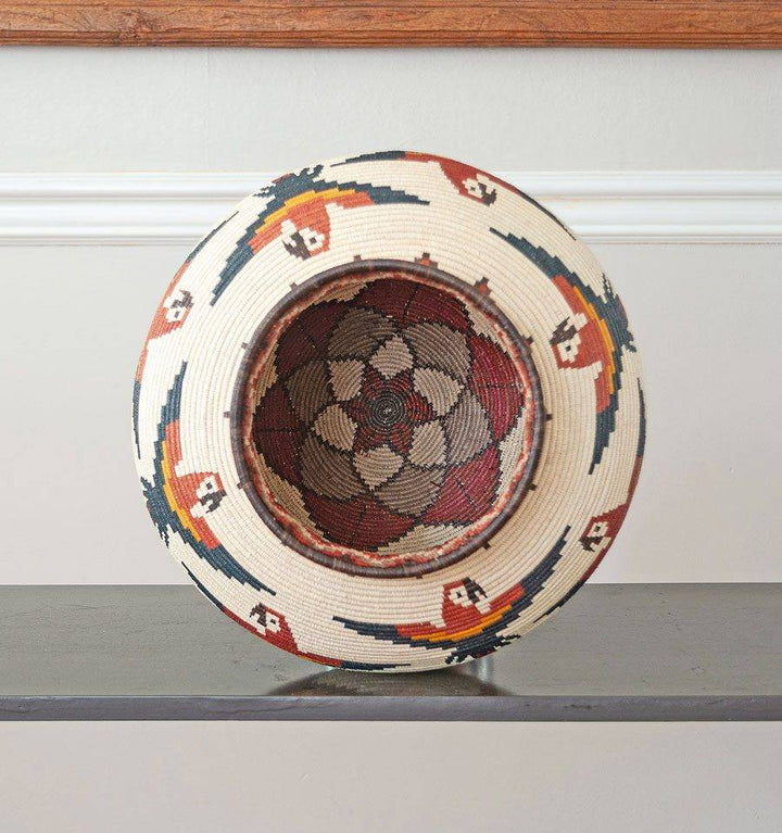 top view of handmade Wounaan macaws basket showing cocobolo wood rim and traditional palm weaving technique