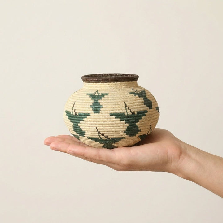 Small woven palm mini basket with green ribbed hummingbird patterns by Wounaan artisans from Panama