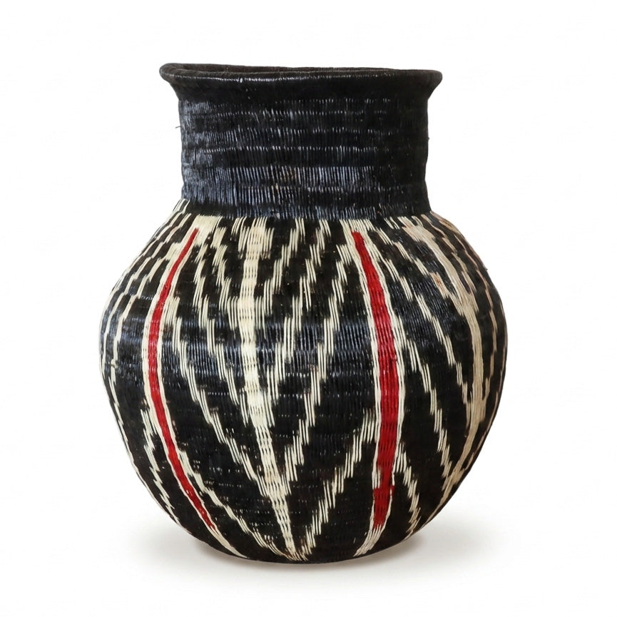 Feather and Ember Jar, one of one werregue basket handwoven by Wounaan weavers in Chocó, Colombia