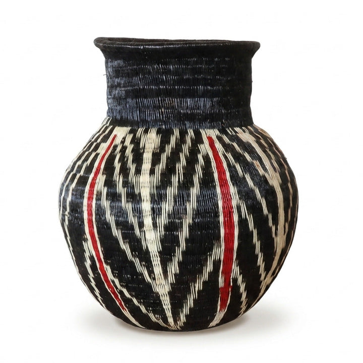 Feather and Ember Jar, one of one werregue basket handwoven by Wounaan weavers in Chocó, Colombia