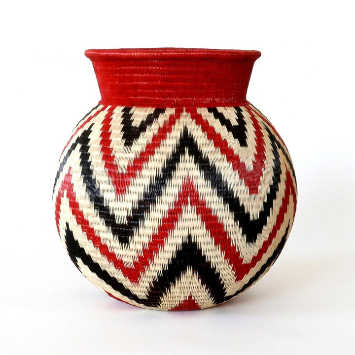 Crimson Flame Jar, one of one werregue basket handwoven by Wounaan weavers in Chocó, Colombia