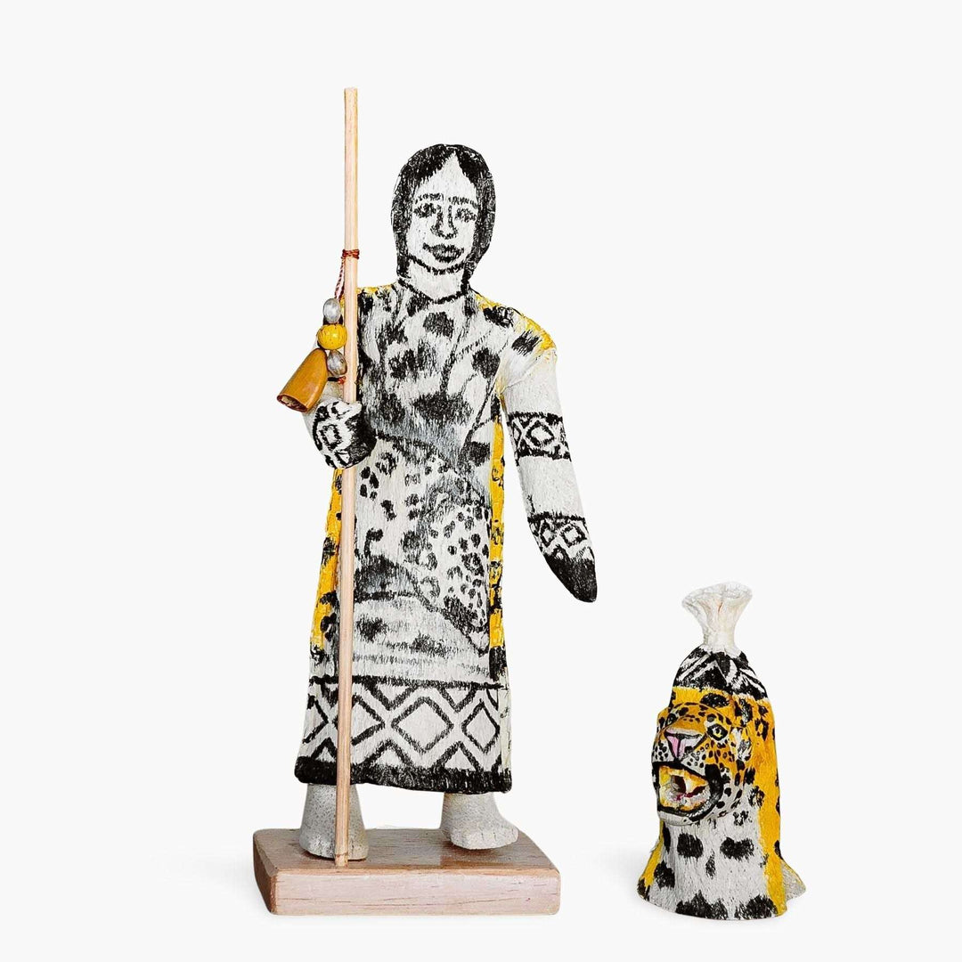 Close-up detail of hand-carved spotted jaguar pattern on Ticuna ceremonial spirit doll
