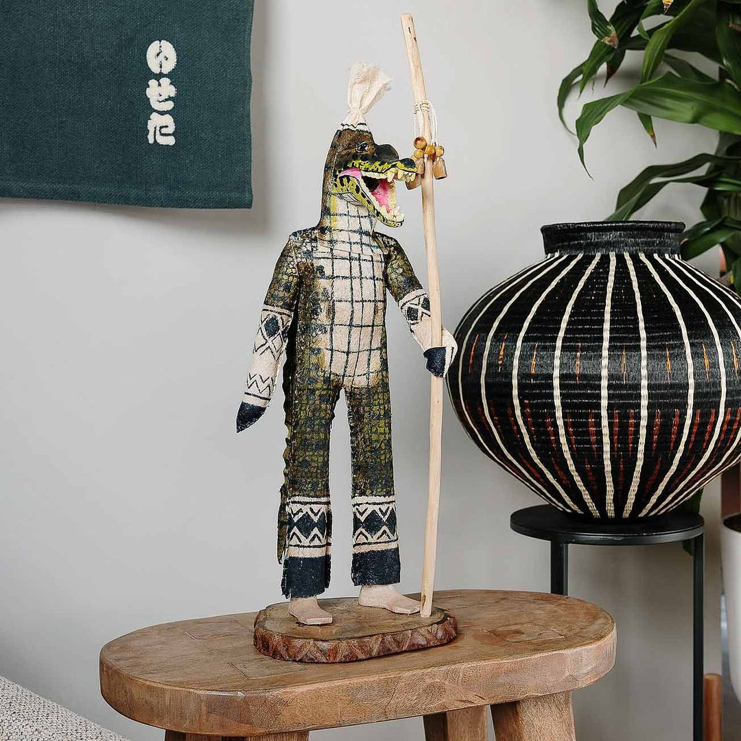 Handcrafted Ticuna crocodile guardian spirit doll with natural fiber construction from Colombian Amazon