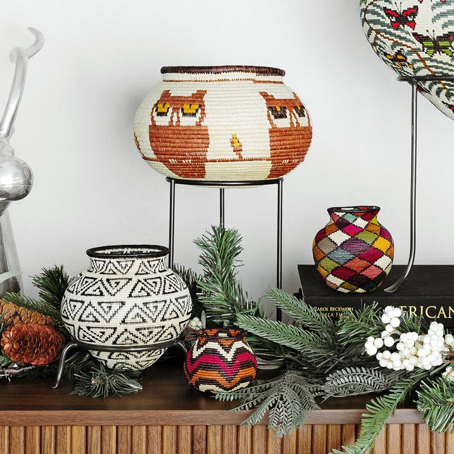 Yellow-eyed owls decorative woven basket displayed as boho art in modern living room interior