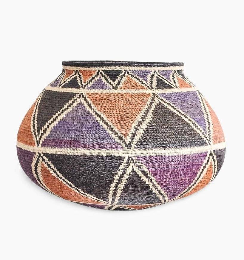 geometric eclipse woven basket with radiating patterns by Wounaan artisans from Panama