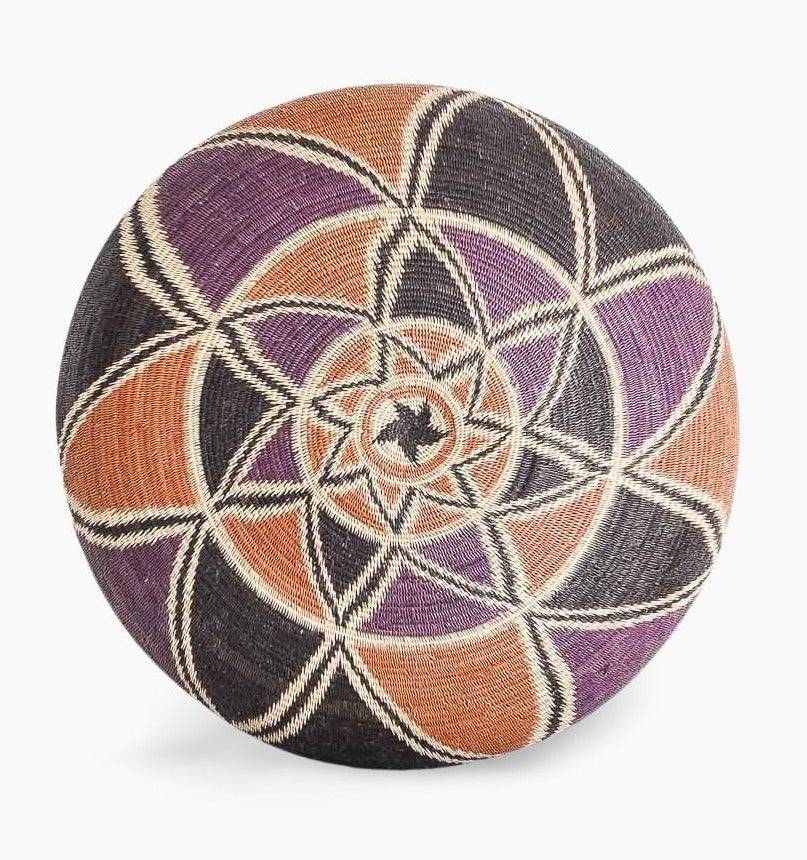 bottom view of decorative woven basket showing dimensional eclipse pattern from Panama