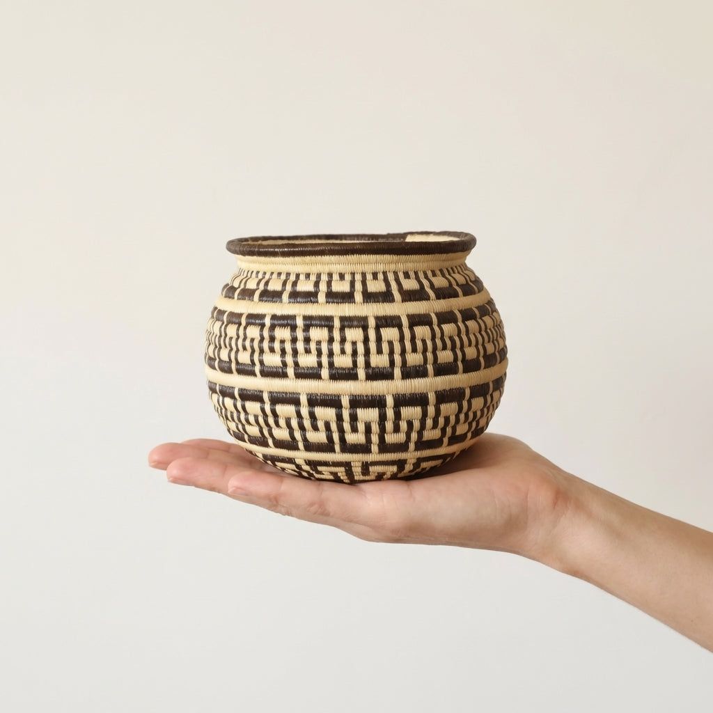 Decorative Wounaan basket with intricate labyrinth pattern handwoven from werregue palm in Panama