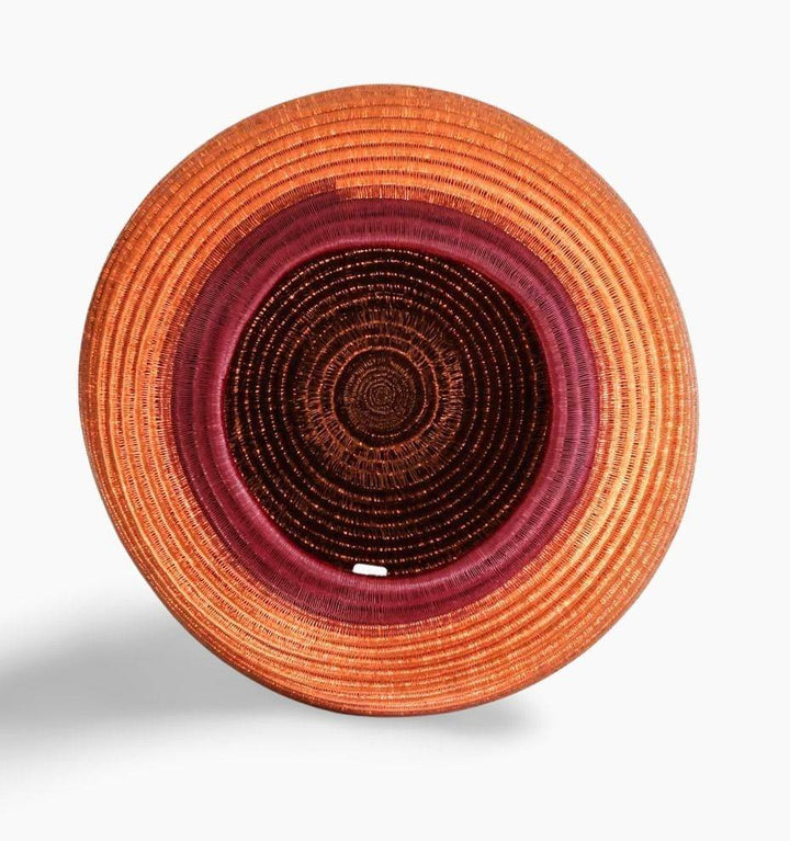 Top angle view of handmade decorative basket showing depth and traditional weaving structure