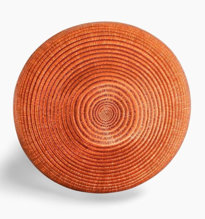Bottom view of handmade decorative basket showing depth and traditional weaving structure