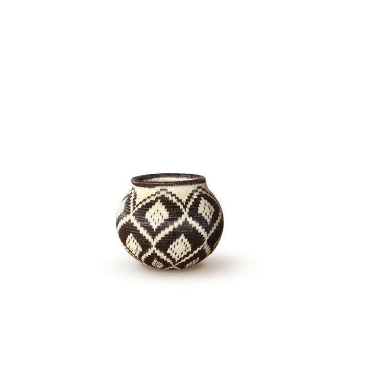 Handwoven Wounaan basket with brown-black and cream nested diamond lattice pattern, rounded vessel from Panama