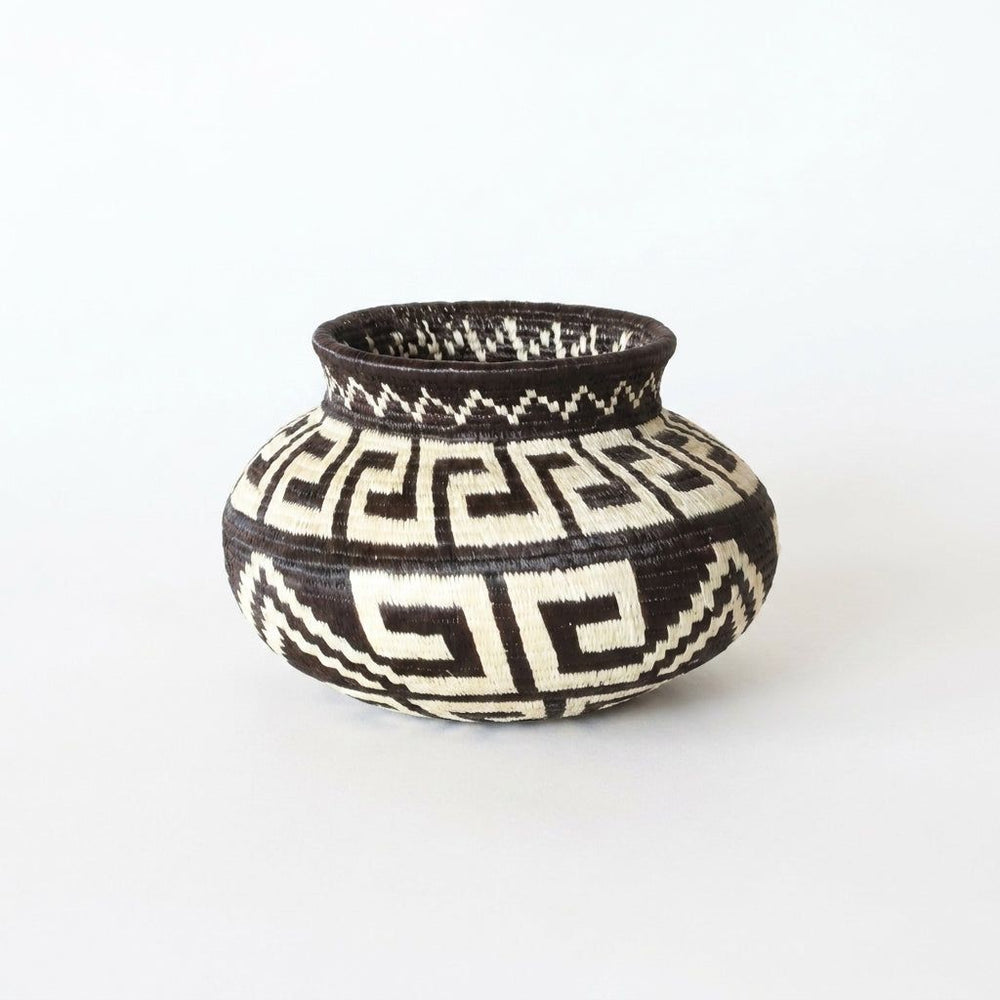 Mini handwoven Wounaan basket with black and ivory Greek-key labyrinth pattern, woven art from Panama's Darién