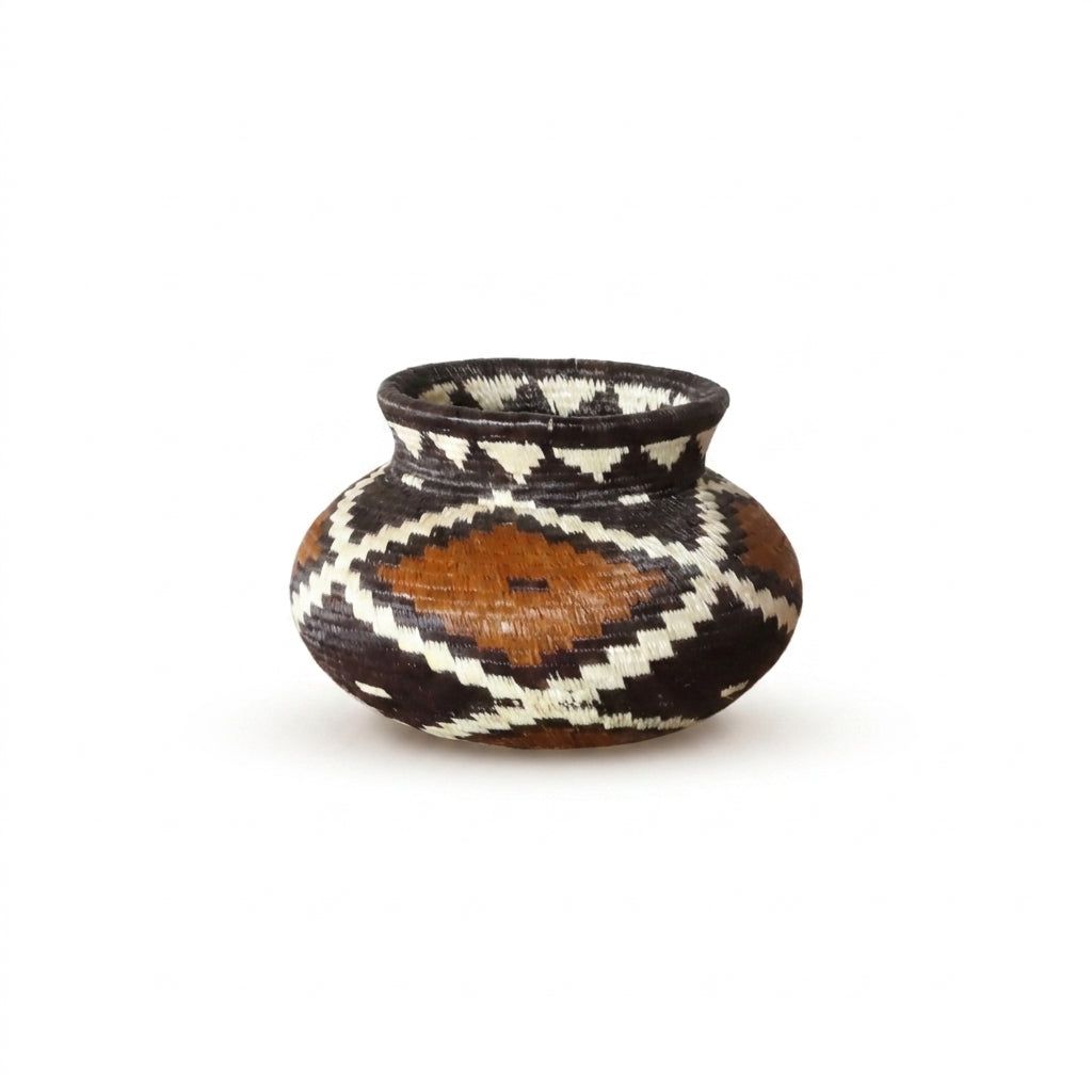 Burnt-orange diamond framed in ivory zigzags on dark tiny Wounaan handwoven basket, Panama woven art