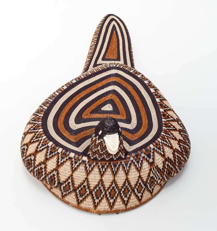Side view of handmade Embera duck spirit mask showing traditional cocobolo wood carving techniques