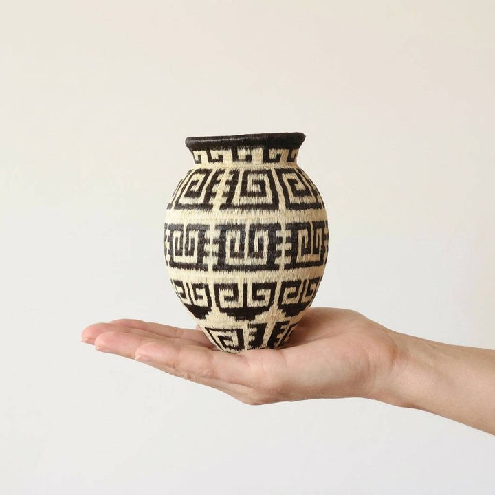 Maze pattern handmade basket in natural palm fiber by Wounaan artisans from Panama's Darién rainforest