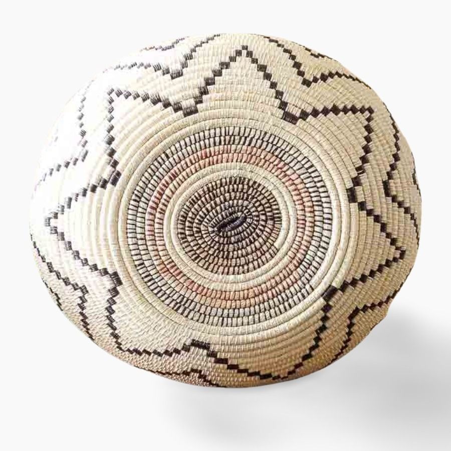 Bottom view of decorative woven basket showing depth and traditional palm fiber craftsmanship from Panama
