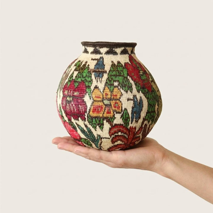 Miniature handwoven basket with floral forest patterns by Wounaan artisans from Panama
