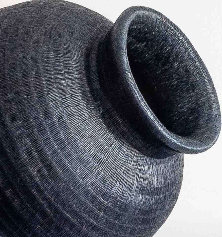 Close-up detail of the weave on the Tall Collar Noir Wounaan basket from Panama