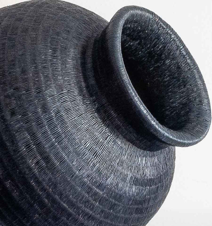 Close-up detail of the weave on the Tall Collar Noir Wounaan basket from Panama