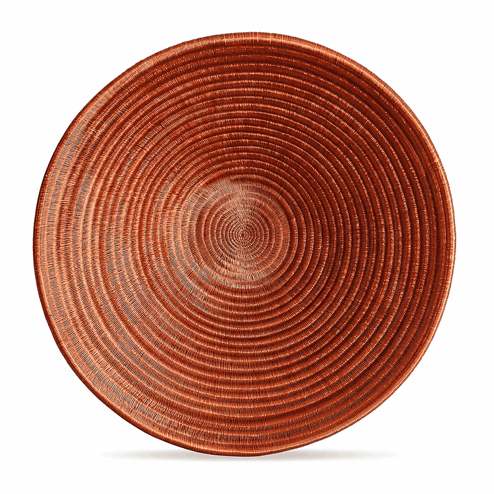 Large molten gold decorative woven plate with flowing amber patterns handcrafted by indigenous artisans