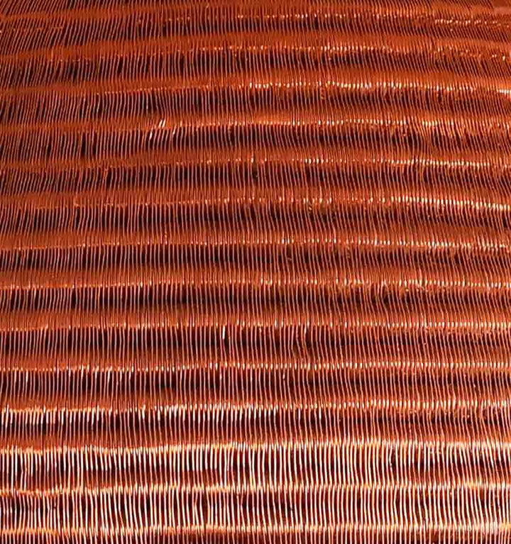 Close-up tight weave pattern detail of handmade tapered basket showing premium palm fiber craftsmanship