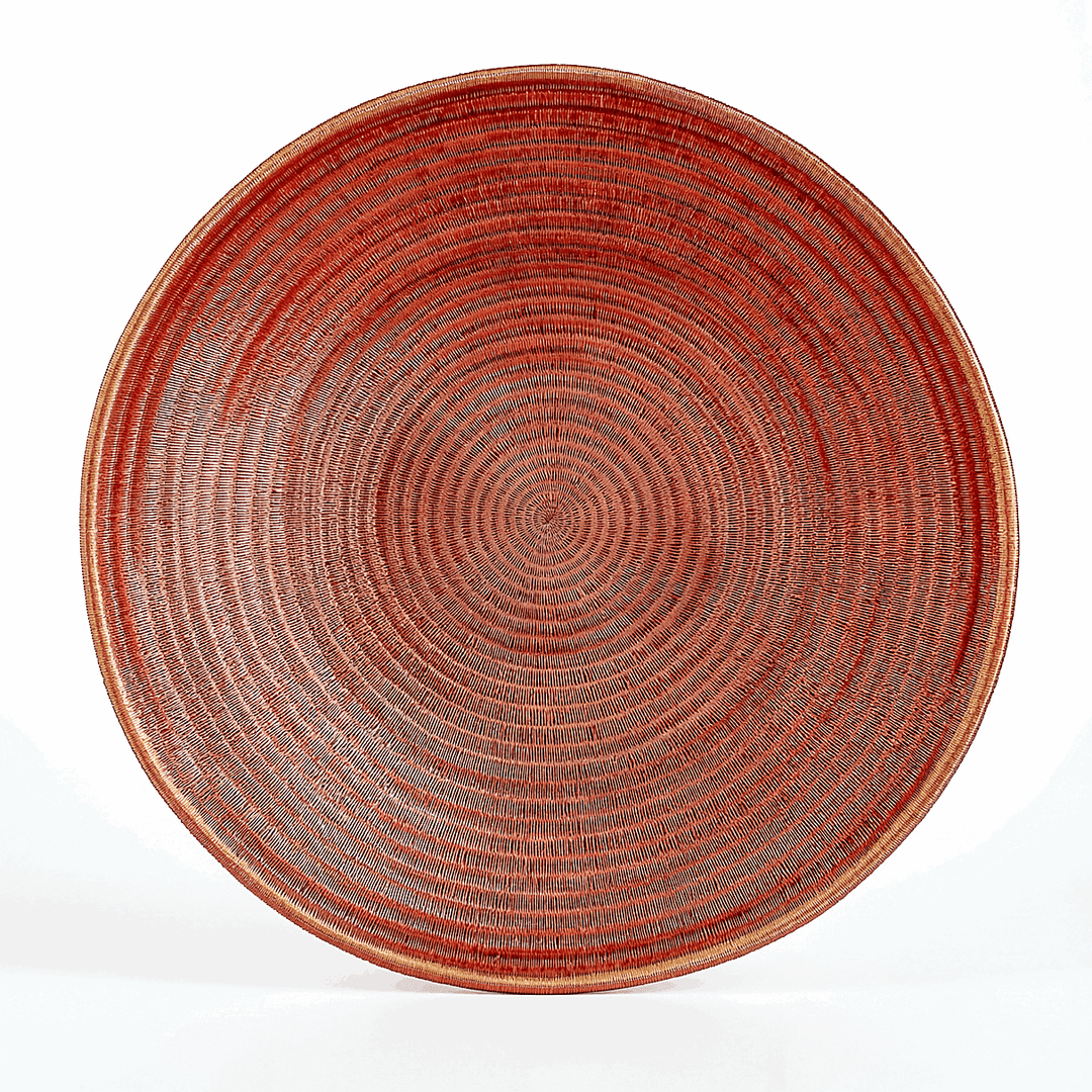 Large copper woven decorative plate with intricate patterns by master artisan Plinio Opua