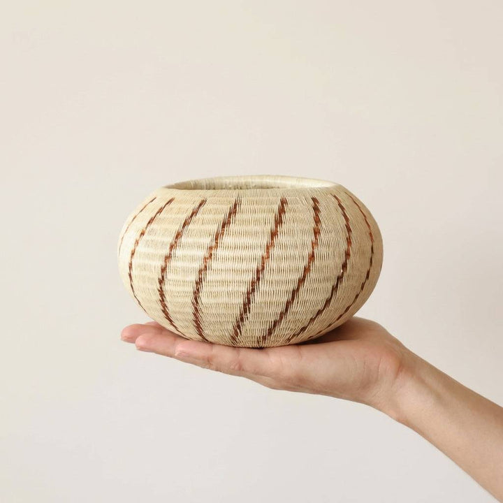 decorative basket copper caracol spiral design werregue palm by Wounaan artisans from Colombia