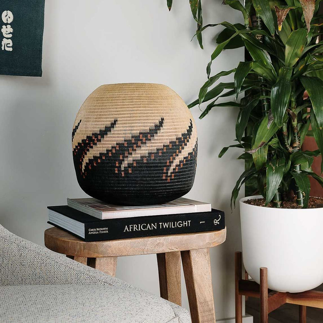 Handwoven Colombian Wounaan basket with copper and dark octopus motif