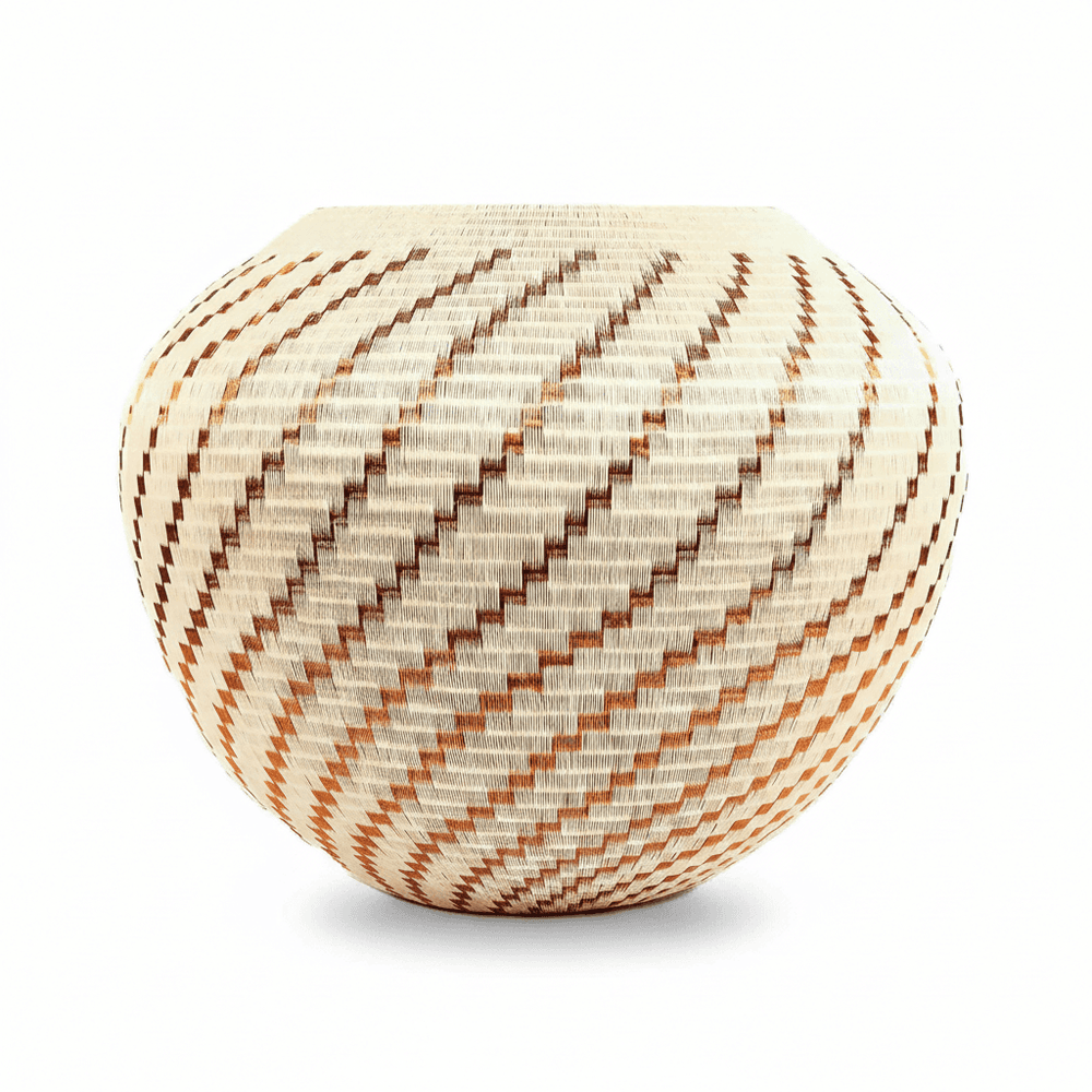 side view of Wounaan basket showing complete copper flame spiral pattern