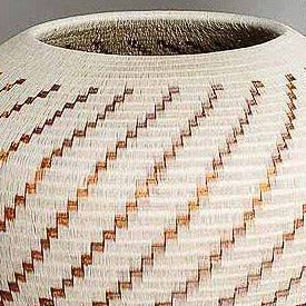 Copper flame pattern handwoven basket by Wounaan artisans from Chocó rainforest