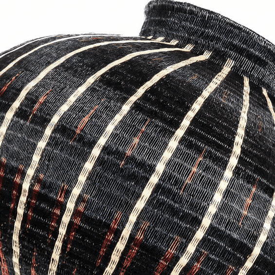 Side angle view woven basket wall art showing dimensional depth of diagonal geometric pattern