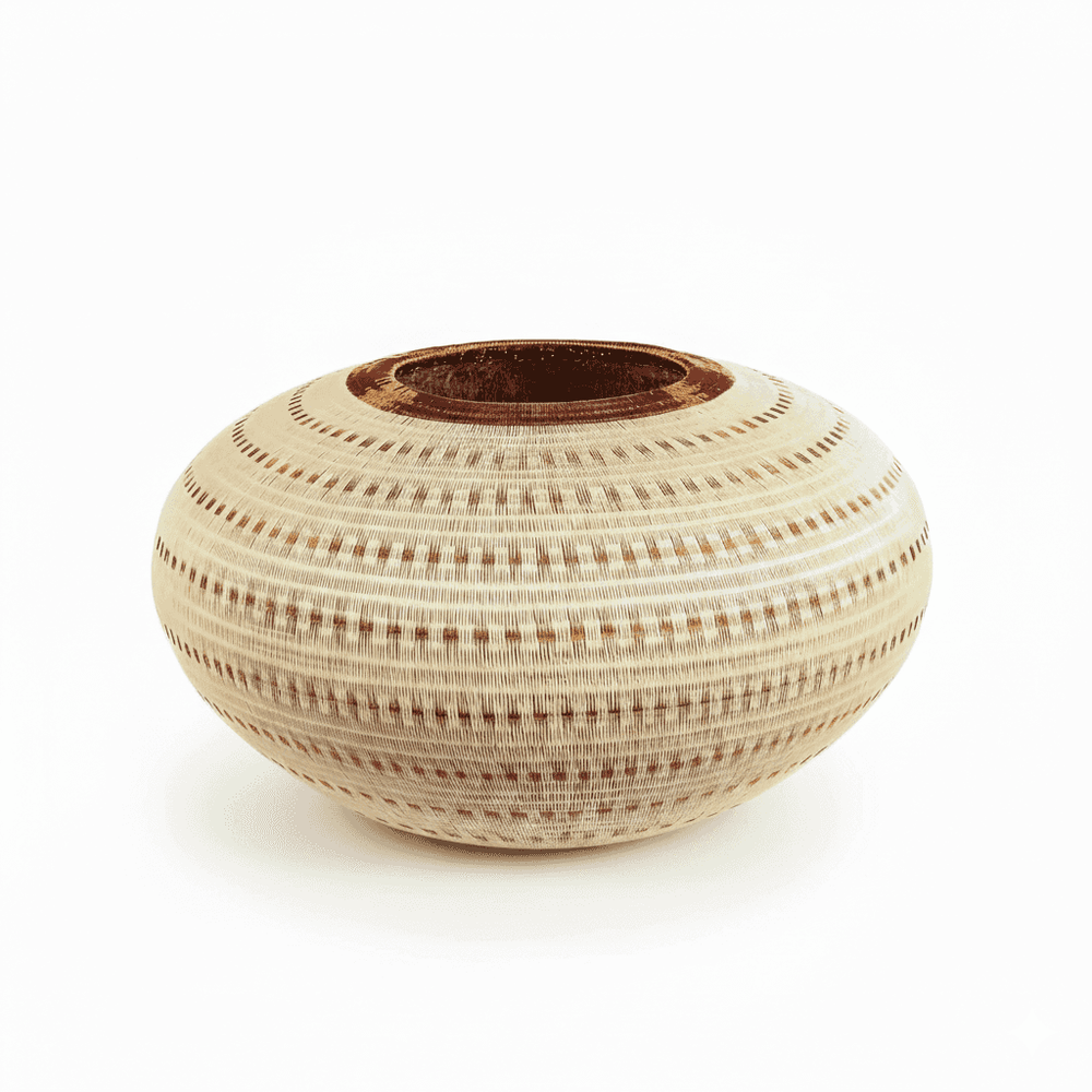 Side view of handmade basket showing three-dimensional vessel form and cascading vertical current design