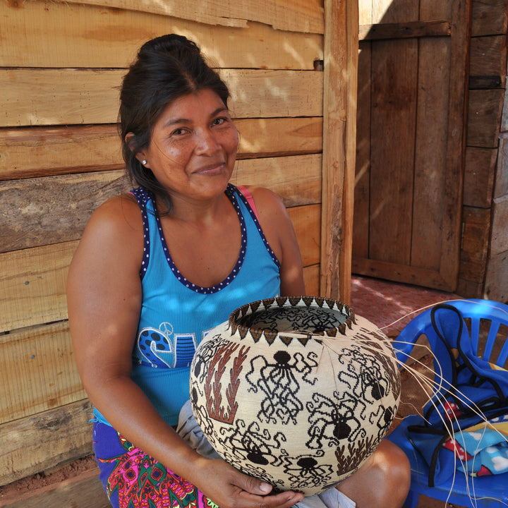 Panama Artisan holding a basket