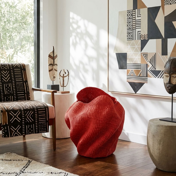 Red wavy sculptural basket styled in an interior