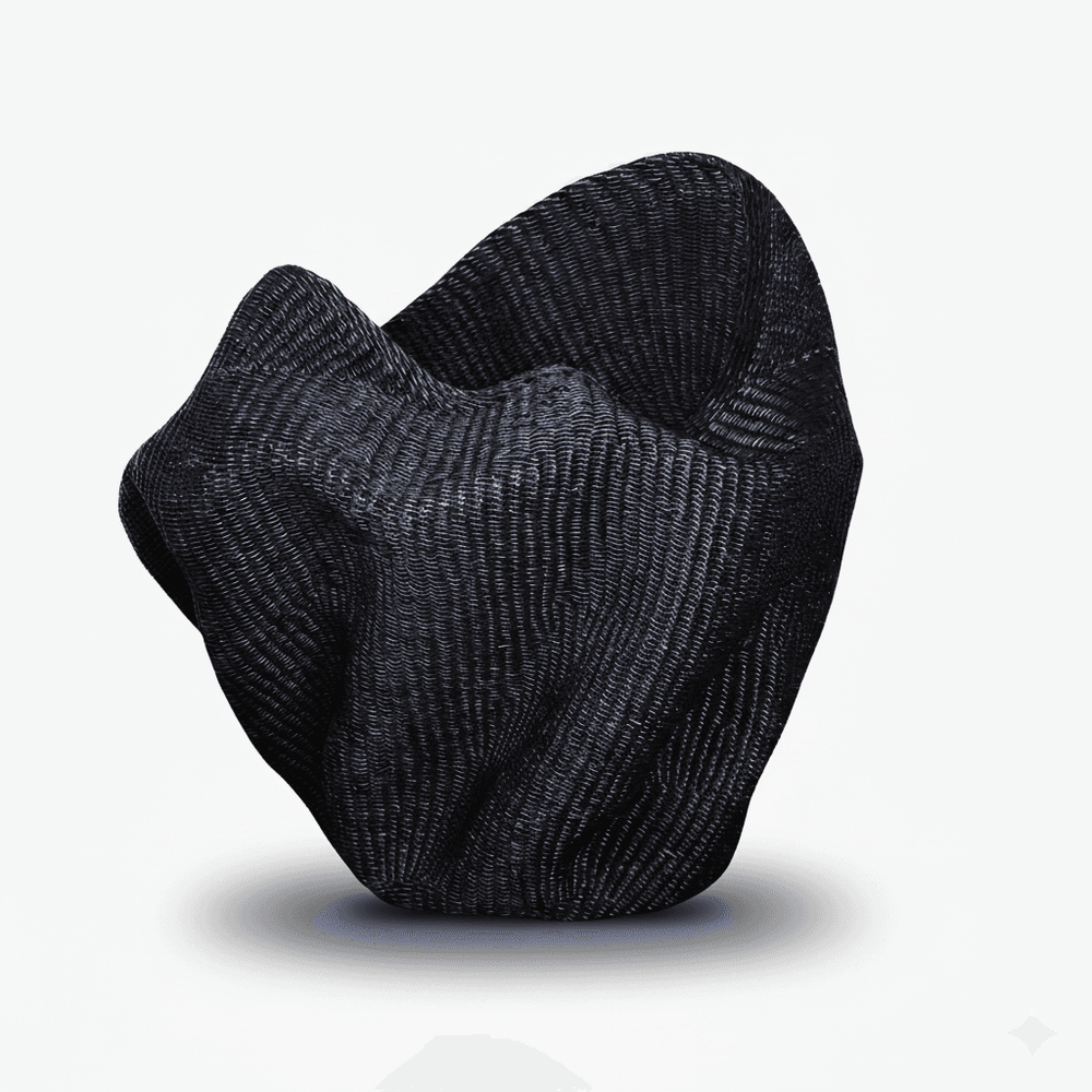 Side angle showing curved wave silhouette and dimensional form of woven basket