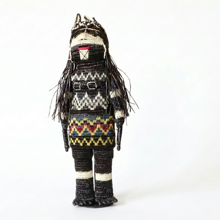 “She Who Gathers” handwoven Emberá Cunana muñeca, female provider figure with feathered crown and gathering basket, front view