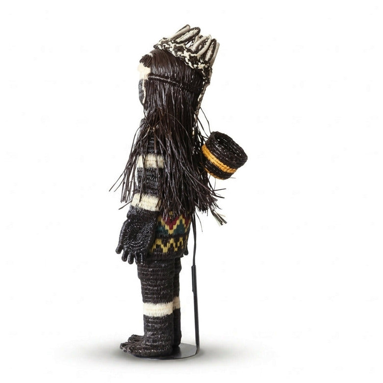 “She Who Gathers” handwoven Emberá Cunana muñeca, female provider figure with feathered crown and gathering basket, side view