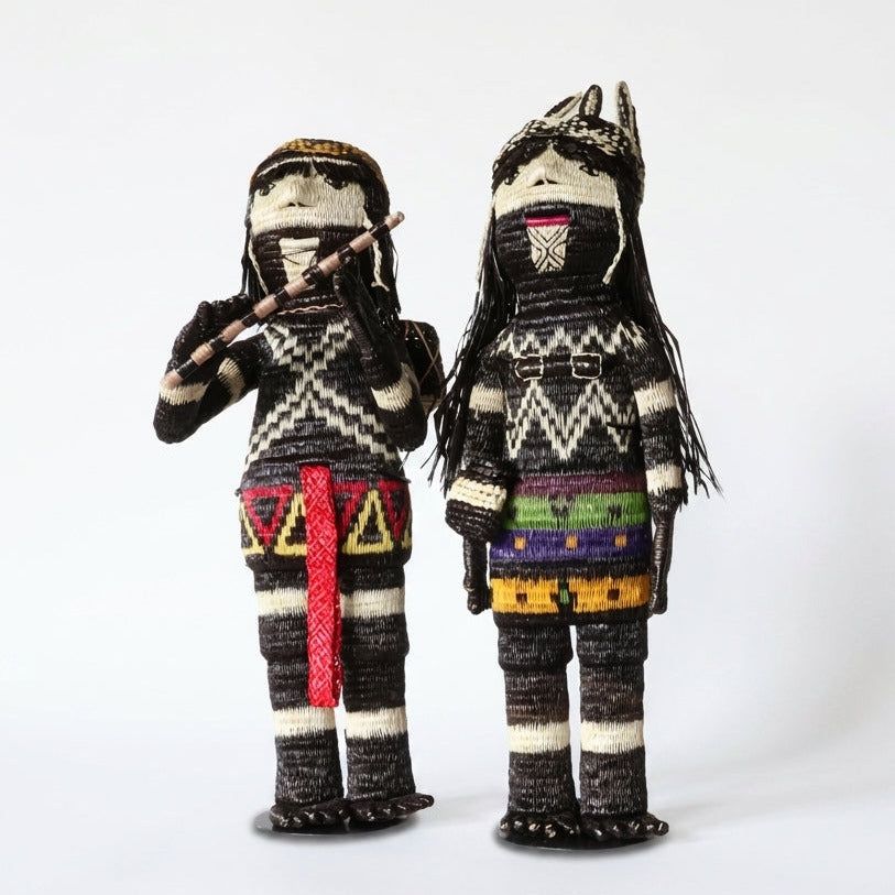 The Keeper and The Flute Player shown together, handwoven Embera figures from Panama