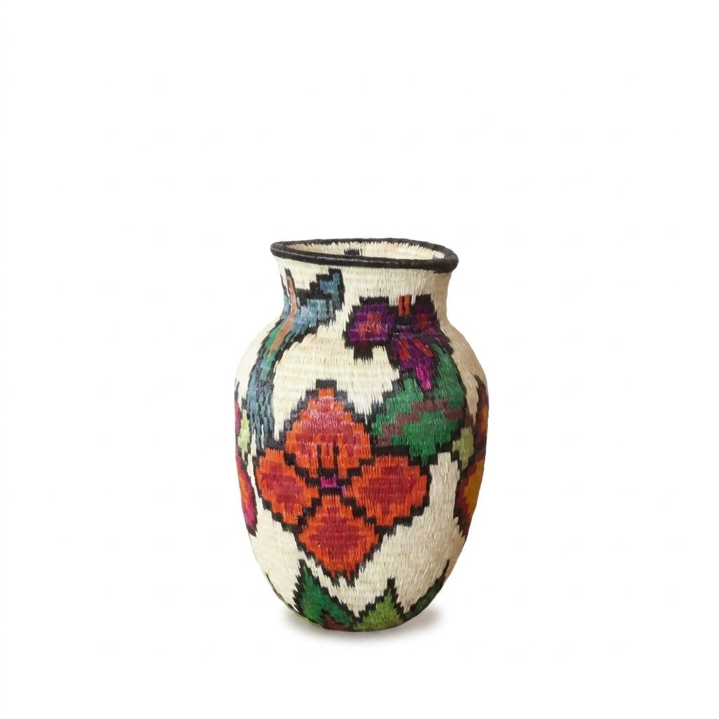 Teal hummingbird, purple orchid and red-orange blossoms on cream handwoven Wounaan basket from the Darién