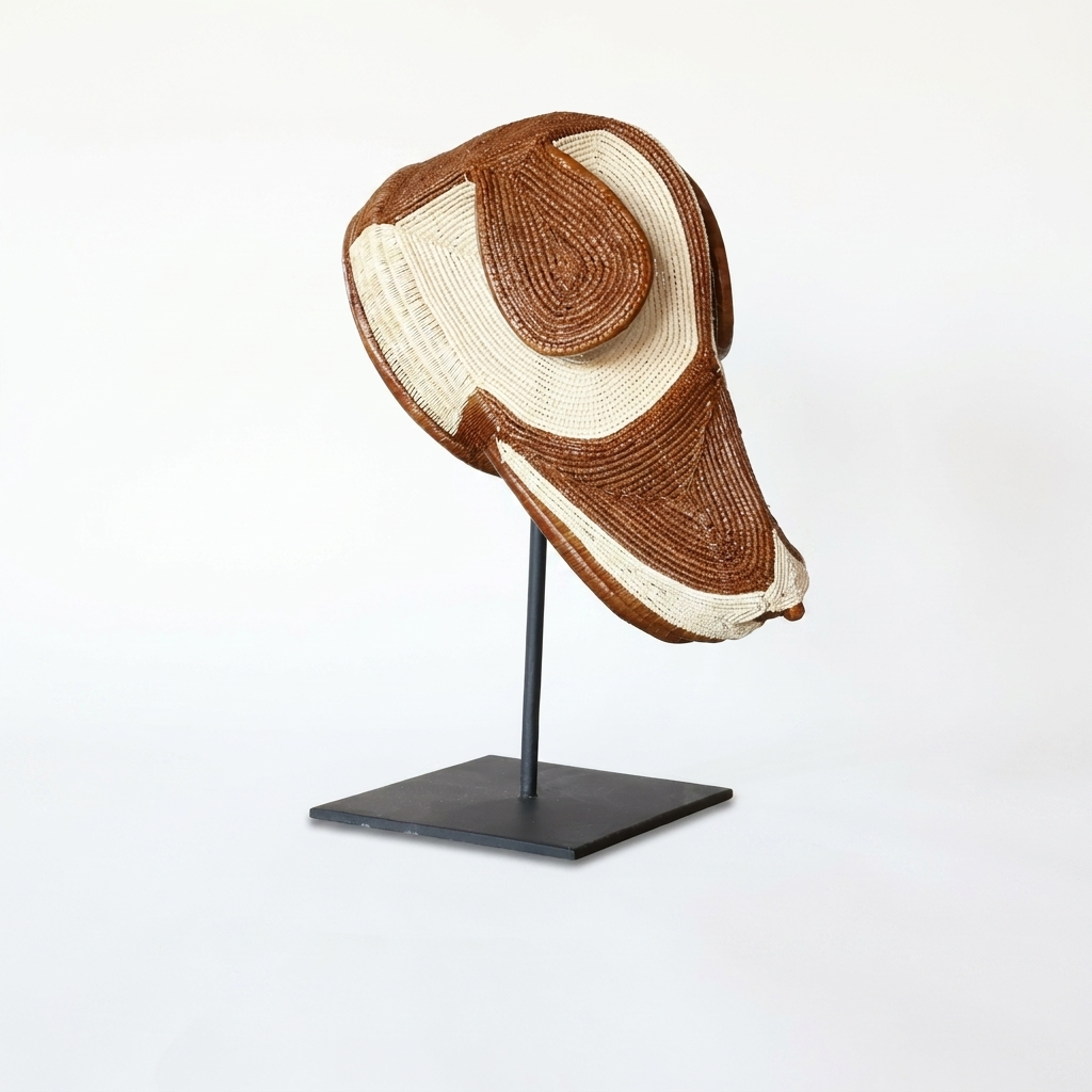 Emberá dog mask alternate view, chestnut and ivory woven palm fiber, Darién Panama