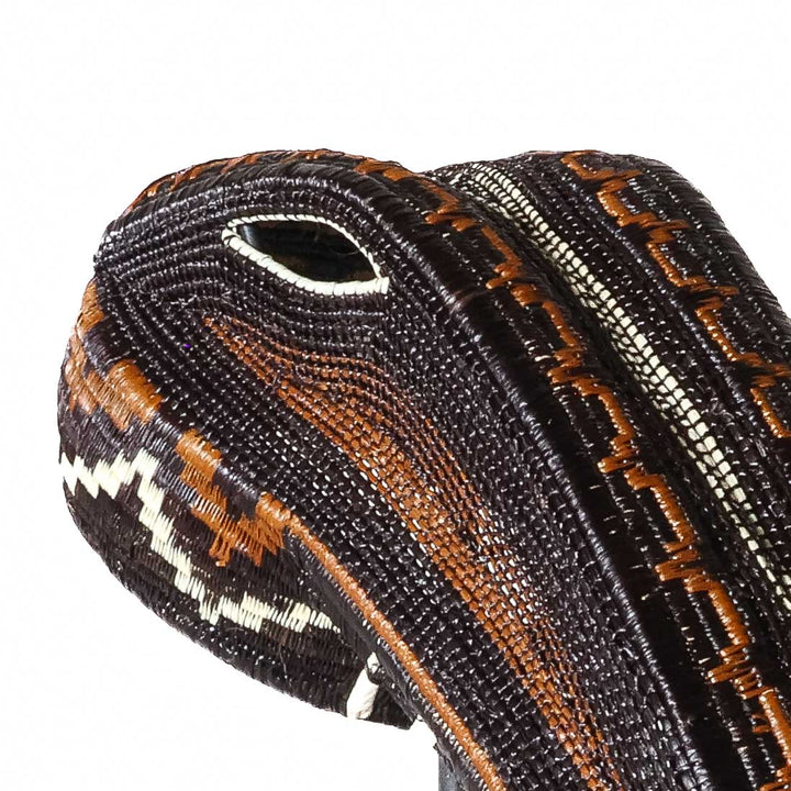 Close-up detail of brown and copper beaded coiling on handwoven Emberá crocodile mask