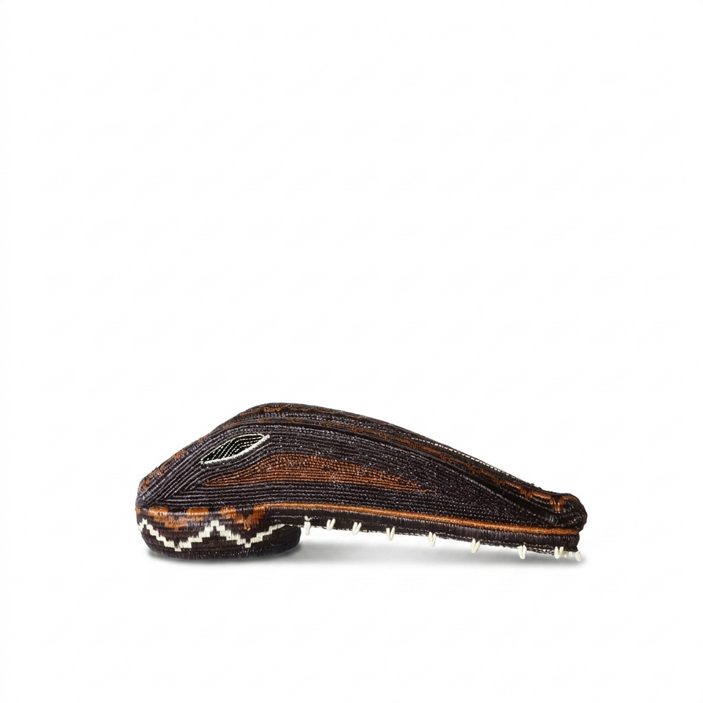 Emberá crocodile woven mask profile in brown and copper with white zigzag teeth, Darién Panama