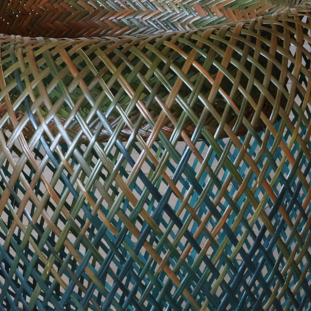 Close-up of traditional plaiting weave pattern showing intricate palm fiber craftsmanship